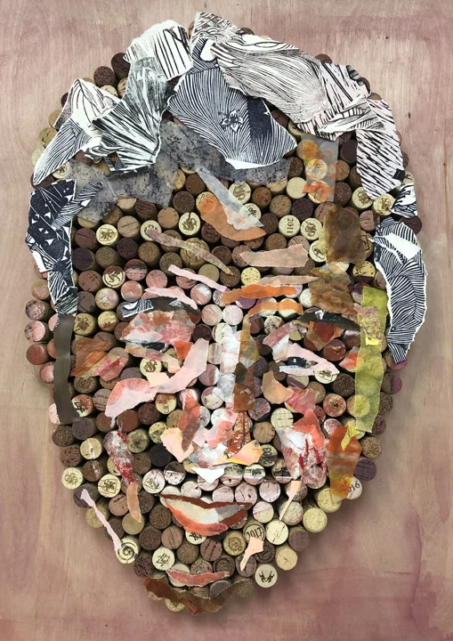 A sculptural portrait assembled from small colorful found objects.