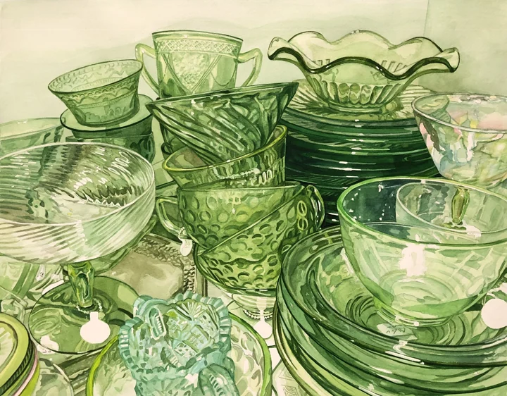 A still life of translucent green glass bowls, cups, and pitchers.