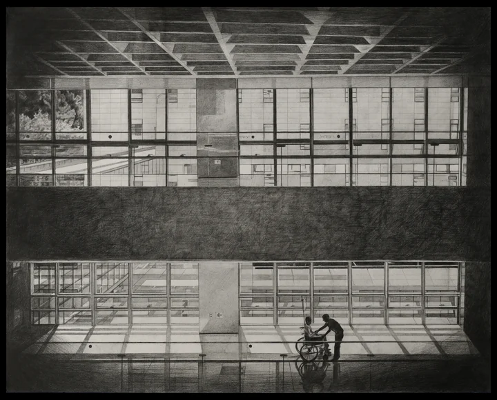 A black-and-white interior with large windows and a small seated figure.