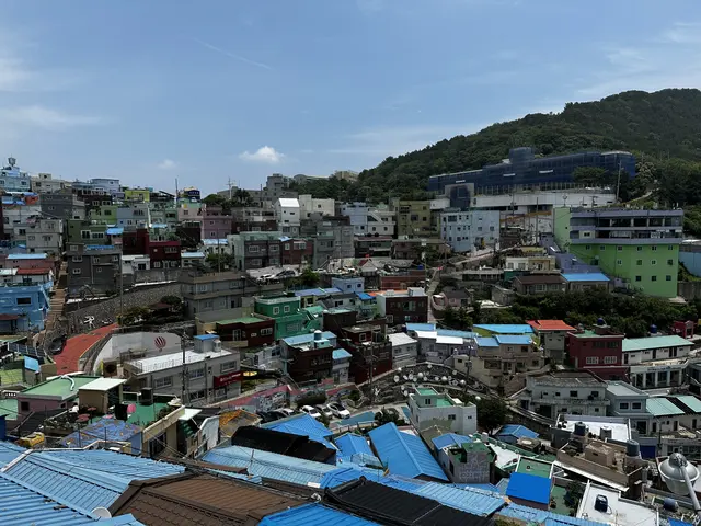Colorful roofs spread across a hillside neighborhood.