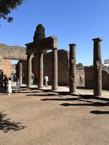 Stone columns among the ruins of Pompeii.