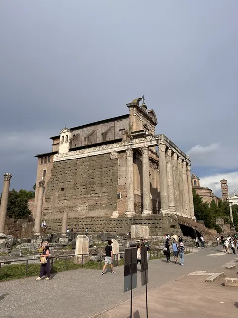 An ancient stone building among archaeological ruins.